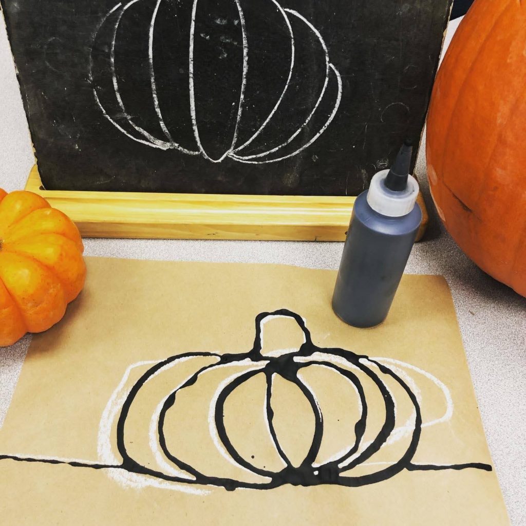 Chalkboard and chalk pumpkin with black glue outline. 