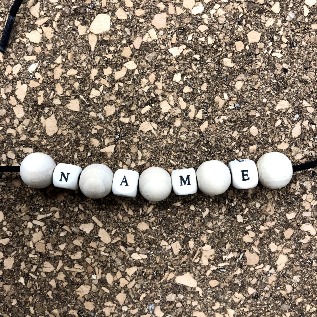 We made name necklaces with each person's name out of these great natural wood beads from Michaels.